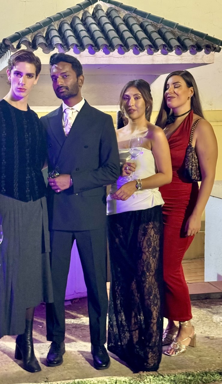 Four people dressed up at an evening event